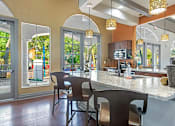 Thumbnail 20 of 34 - A kitchen with a counter and chairs. at Reserve at Canyon Creek, San Antonio, Texas
