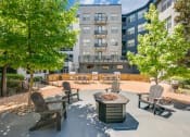 Thumbnail 3 of 12 - Outdoor Entertaining Space with Cozy Fireside Feature at The Atlantic Highland Park, Dallas, 75209