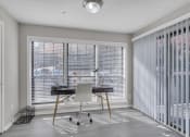 Thumbnail 5 of 16 - Home office with blinds on the windows and a desk with a chair at The Atlantic Briarcliff, Atlanta, Georgia