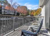 Thumbnail 10 of 16 - Patio with two chairs and a railing on a balcony at The Atlantic Briarcliff, Atlanta, Georgia