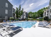 Thumbnail 7 of 12 - Sparkling Lap Pool with lounges at Sloan Square, Atlanta, GA, 30329.