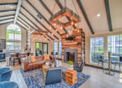Thumbnail 3 of 10 - Resident Lounge with Media and Coffee Station at Logans Mill, Austin, TX.