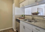 Thumbnail 23 of 34 - Kitchen with cabinets at The Atlantic Mansfield, Mansfield, TX