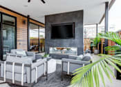 Thumbnail 12 of 43 - 400 Rose Outdoor Lounge with Fireplace and Seating