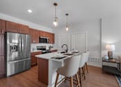 Thumbnail 7 of 15 - Kitchen with an island at The Landing at Hub City, Plymouth, WI