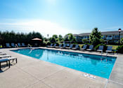Thumbnail 5 of 30 - A pool with a blue water and a sign that says "NO DIVING".