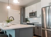 Thumbnail 10 of 30 - Island Kitchen at Tivoli Green Apartments & Townhomes, Mount Pleasant, 53406
