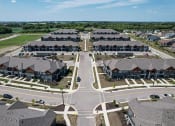 Thumbnail 25 of 30 - Aerial Exterior View at Tivoli Green Apartments & Townhomes, Mount Pleasant, WI, 53406