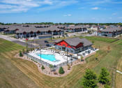 Thumbnail 2 of 30 - Drone View Of Pool at Tivoli Green Apartments & Townhomes, Wisconsin, 53406