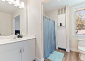 Thumbnail 7 of 12 - bathroom view with shower, sink, and toilet