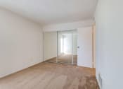 Thumbnail 9 of 13 - bedroom with mirrored closet doors