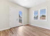 Thumbnail 1 of 12 - living room and front door
