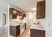 Thumbnail 4 of 13 - kitchen with stove, fridge, counters and sink