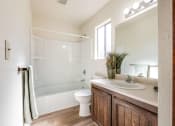 Thumbnail 8 of 13 - bathroom with toilet, shower, and sink