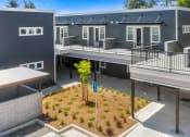 Thumbnail 5 of 12 - outdoor view of apartments with landscaping