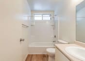 Thumbnail 13 of 20 - bathroom with toilet, sink, and shower
