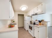 Thumbnail 8 of 27 - kitchen with counters, fridge, stove and sink
