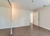 Thumbnail 13 of 27 - Bedroom with mirrored closet doors