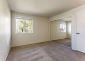 Thumbnail 3 of 27 - bedroom with mirrored closet doors
