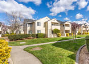 Thumbnail 27 of 27 - exterior of apartments and lawn