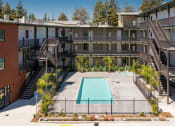 Thumbnail 2 of 30 - pool and exterior of building