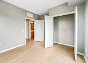Thumbnail 14 of 22 - A room with a white door and a white closet.