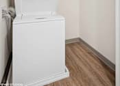 Thumbnail 30 of 58 - A white dishwasher is in a small kitchen.