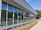 Thumbnail 2 of 3 - the side of a building with glass windows