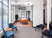 Thumbnail 16 of 37 - a conference room with a table and chairs and large windows