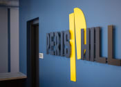 Thumbnail 33 of 37 - a blue wall with a sign that says design refresh on it