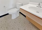 Thumbnail 10 of 46 - A photo of a toilet and vanity at Stryker Senior Apartments in West St. Paul 