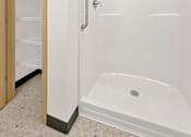 Thumbnail 11 of 46 - A walk-in shower at Stryker Senior Apartments in West St. Paul 