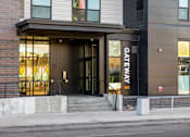 Thumbnail 9 of 31 - A building with a black door and a sign that says "GATEWAY NE".