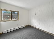 Thumbnail 17 of 29 - A photo of an apartment bedroom at Liberty Plaza with a window and carpeted floor