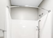 Thumbnail 7 of 22 - A white bathroom with a shower and tub.