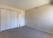 Thumbnail 13 of 30 - Bedroom facing closet doors, carpet on floors