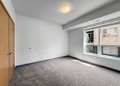 Thumbnail 9 of 35 - a bedroom with a large window
