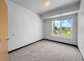 Thumbnail 18 of 35 - a bedroom with a large window