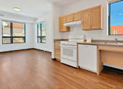 Thumbnail 6 of 46 - Another view of a Stryker Senior Apartments in West St. Paul  kitchen with wooden floors and white appliances.