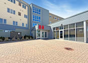 Thumbnail 1 of 20 - The number 88 is displayed on the front of a building.