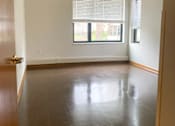 Thumbnail 9 of 9 - A photo of a bedroom and window with blinds half open at Gateway Lofts in North Minneapolis