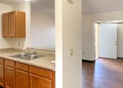 Thumbnail 4 of 11 - Kitchen Facing Dinning & Entry Door