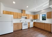 Thumbnail 15 of 35 - A photo of a kitchen with white appliances and a window