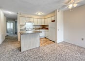 Thumbnail 3 of 40 - A kitchen with a white refrigerator and a countertop.