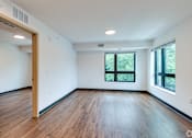 Thumbnail 36 of 46 - a Stryker Senior Apartments in West St. Paul living room with wood floors and a window