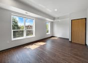 Thumbnail 17 of 35 - a living room with large windows