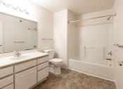 Thumbnail 23 of 30 - Bathroom with sink, vanity, toilet and shower/tub combo