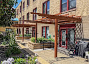 Thumbnail 3 of 30 - A building with a red and white striped awning.