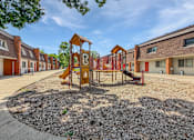 Thumbnail 3 of 29 - A photo of one of two Liberty Plaza Playgrounds with building in the background