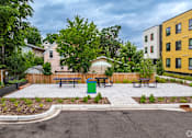 Thumbnail 29 of 46 - the Stryker Senior Apartments spacious patio with picnic tables